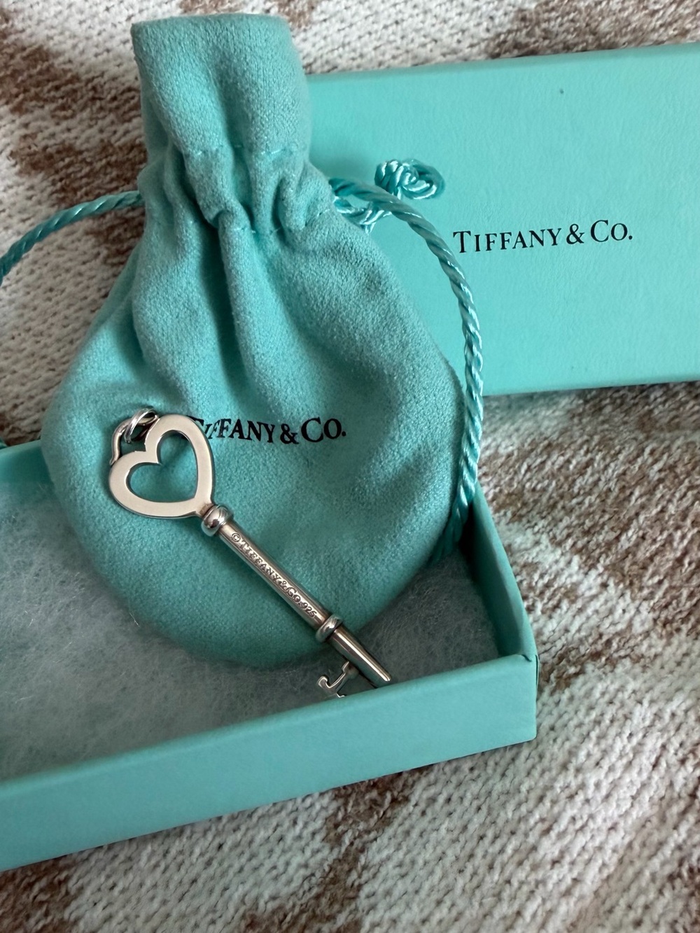 Tiffany & Co. Silver Heart Key Pendant with Blue-Green Pouch